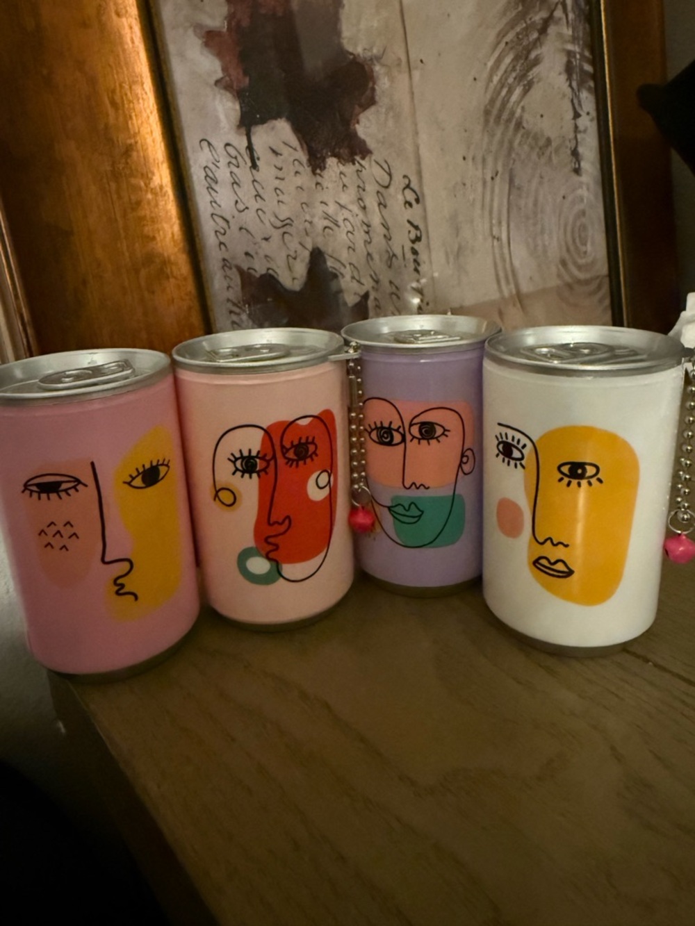 Abstract Face Cans of Keychain Hand Wipes in Pastel Pink, Peach, Lavender, White
